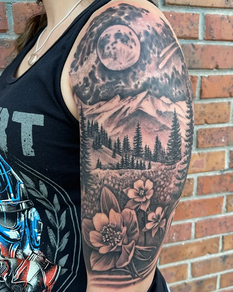 Half sleeve of a full moon over mountains and pine forest, with columbine flowers in a meadow below